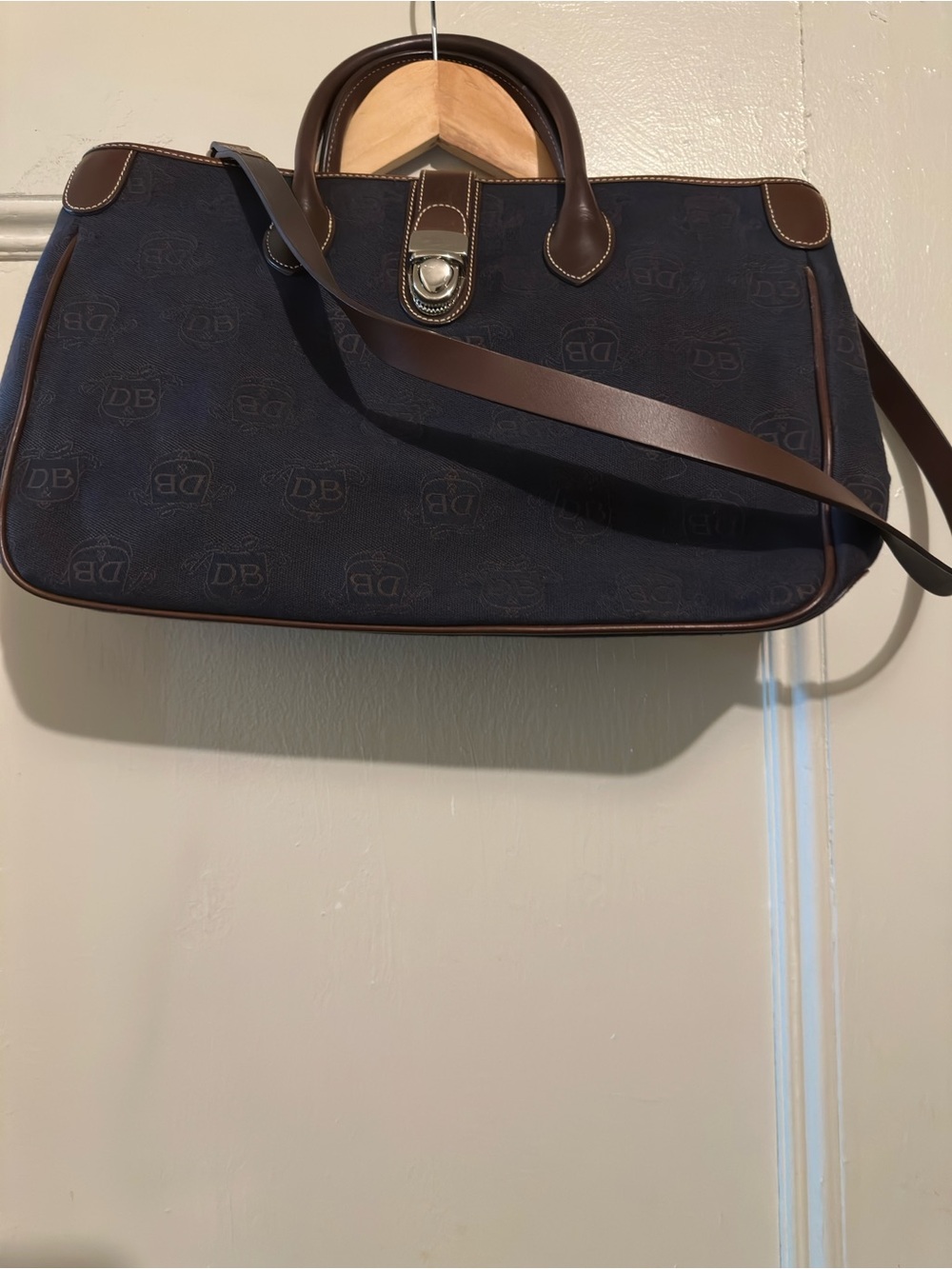 Like New Womenโs Vintage Dooney & Bourke Navy Brown Donegal Crest bag.